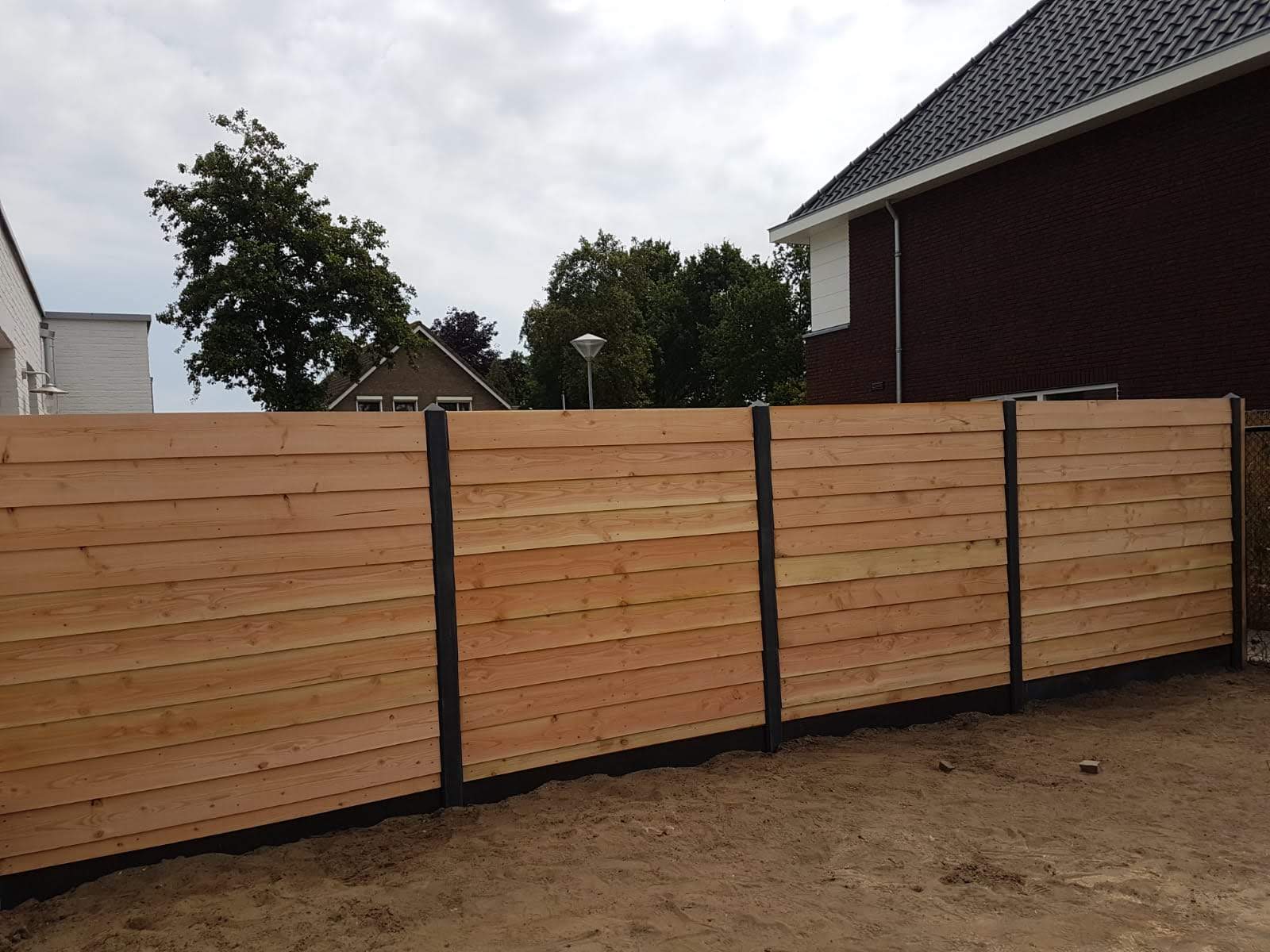 Ontwaken vers Toeschouwer Hout-beton schutting - Dennis Hekwerken