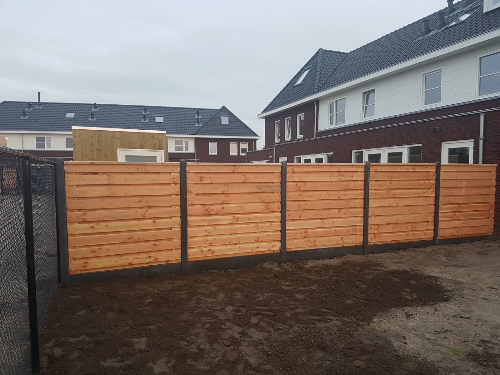 Ontwaken vers Toeschouwer Hout-beton schutting - Dennis Hekwerken